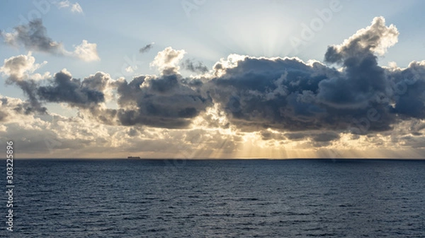 Fototapeta sunset on the sea with beautiful cloud patterns