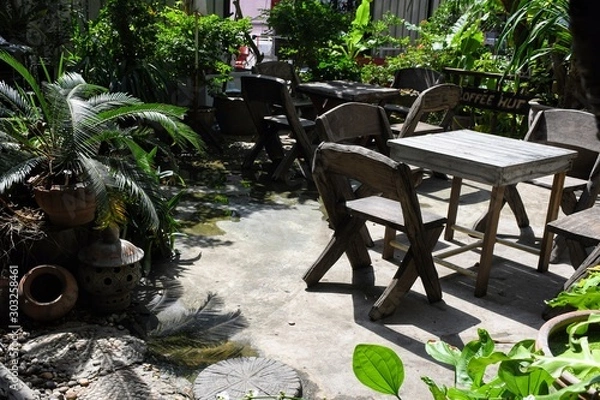 Obraz table and chairs in garden