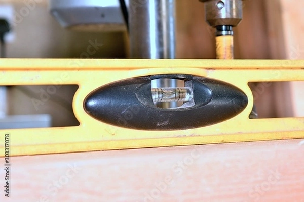 Fototapeta A close up image of a leveling tool being used