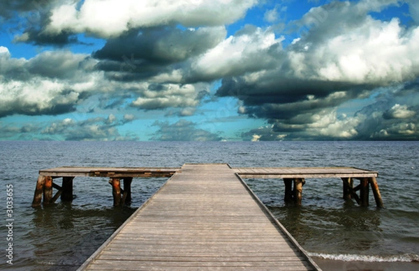Obraz stormy clouds over wooden jetty