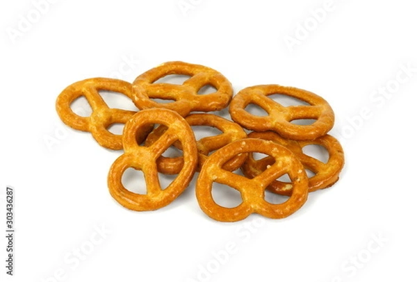 Fototapeta Few pretzels on a white background.