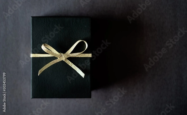 Obraz Black gift box dark background.