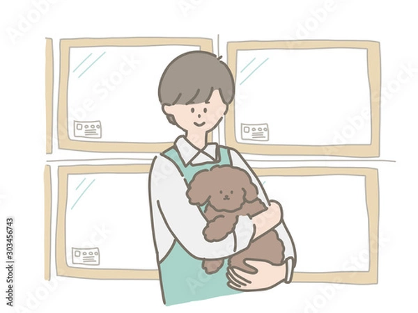 Obraz 子犬を抱っこするペットショップの店員さん