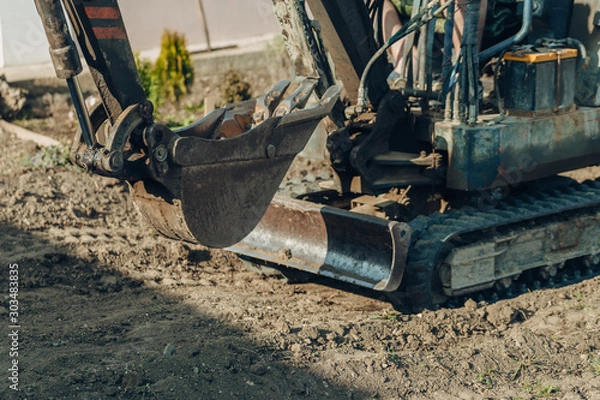 Fototapeta Excavator mechanical part for digging. Machines and mechanisms for construction.