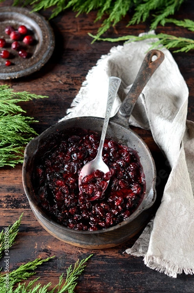 Fototapeta Cranberry sauce in a pan, christmas, rustic