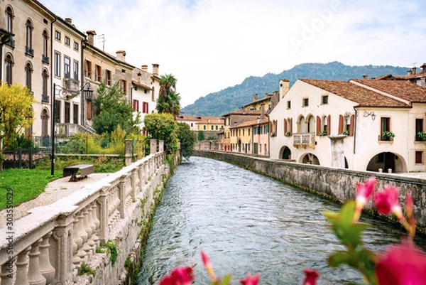 Obraz Panoramic view of the river Meschio and town of Serravalle, part of Vittorio Veneto in Italy