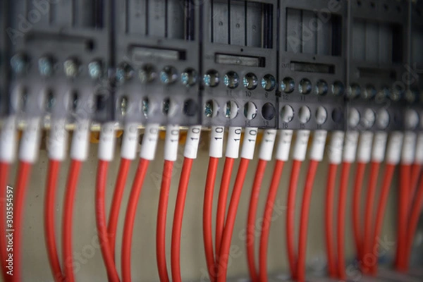 Fototapeta Wiring terminals in the electrical Cabinet. Electrical wires or cables are connected to electrical equipment