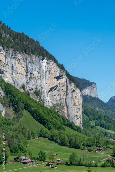 Fototapeta Panoramic view of Lauterbrunnen, the Staubbach fall and the Lauterbrunnen Wall.