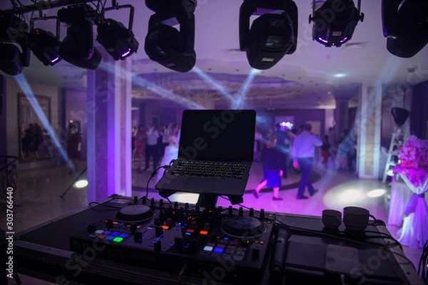 Obraz close up photo of a mixing desk in the dark at a wedding
