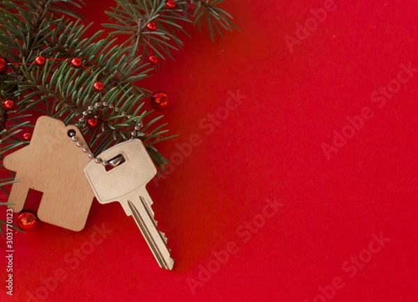 Fototapeta Christmas decoration: decorative house and key to the lock. Concept of finance and housing loans