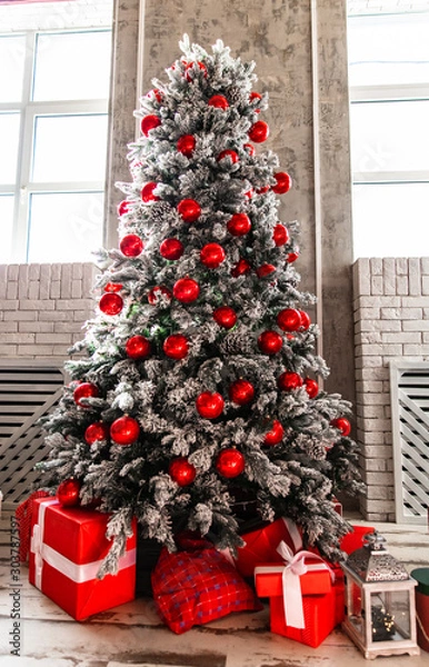 Fototapeta Beautiful christmas tree with gifts in the interior