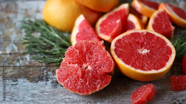Fototapeta Fresh juicy grapefruits. Vegan diet. Healthy food. Keto diet. Selective focus. Macro.