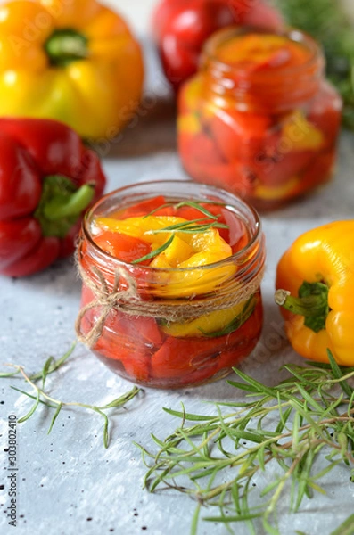 Obraz Pickled baked bell peppers on a gray background