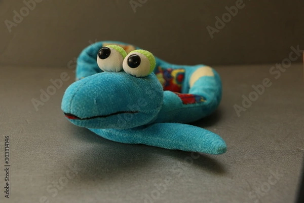 Obraz frog and toy  snake 