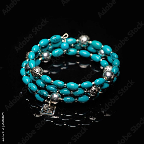 Obraz beads necklace on black background