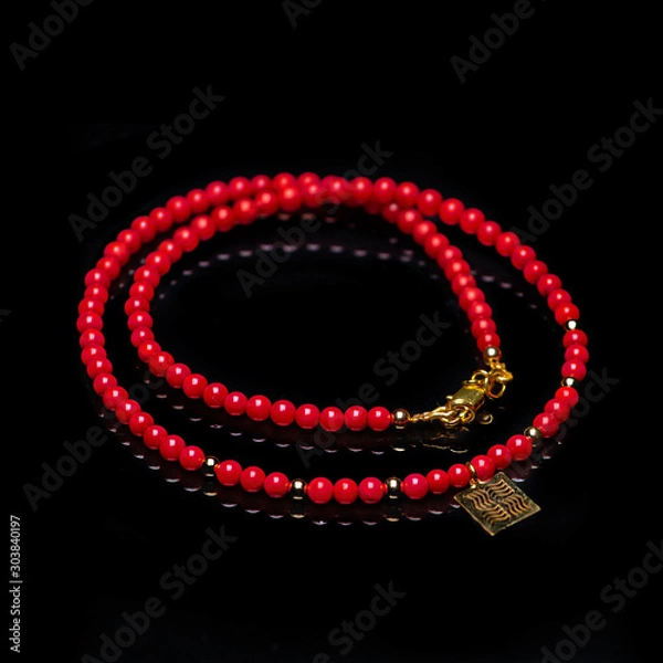 Obraz beads necklace on black background