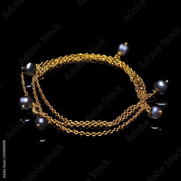Obraz beads necklace on black background
