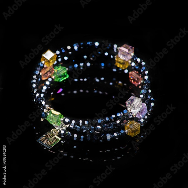 Obraz beads necklace on black background