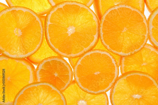 Fototapeta Slices of fresh tangerines as background, top view