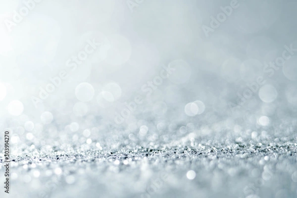 Obraz Silver Sparkling Lights Festive background with texture. Abstract Christmas twinkled bright bokeh defocused and Falling stars. Winter Card or invitation	