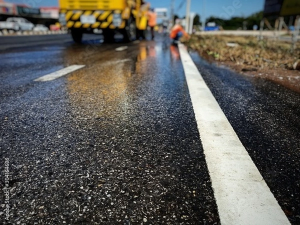 Obraz Cleaned road surface From washing and sweeping