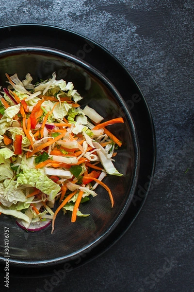 Fototapeta vegetable salad (Chinese cabbage, carrot, onion, lettuce, mix salad) menu concept. food background. top view. copy space