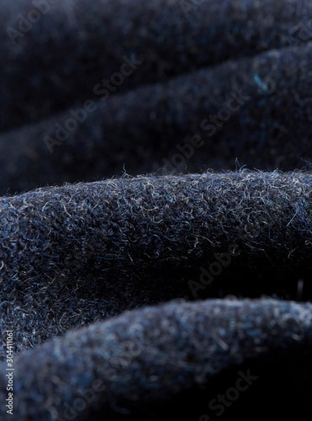 Fototapeta Textile - Fibers close-up showing paterns of the fabric. Soft background and ondulations creating shadows and volumes