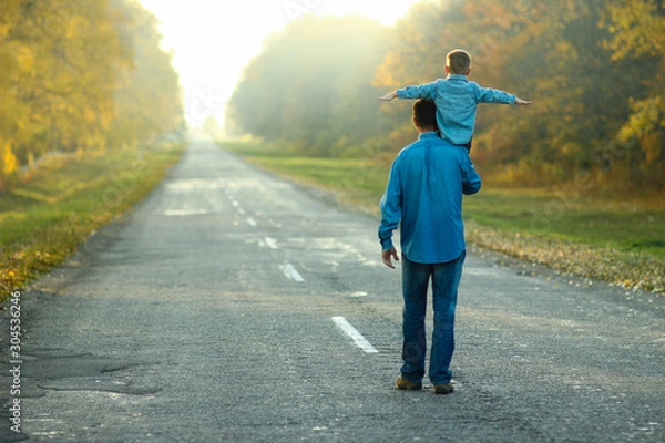 Fototapeta father and son walk in nature
