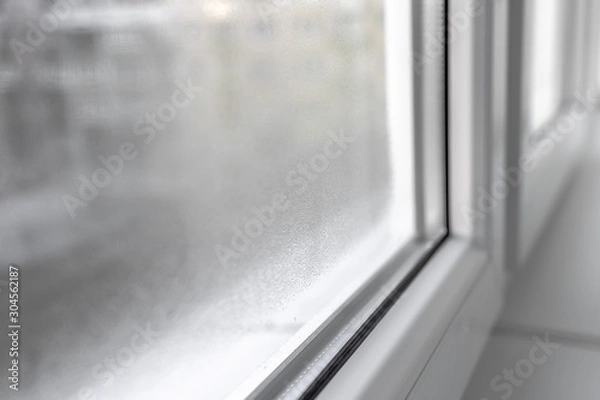 Obraz Water condensation on PVC windows during autumn. Plastic window.