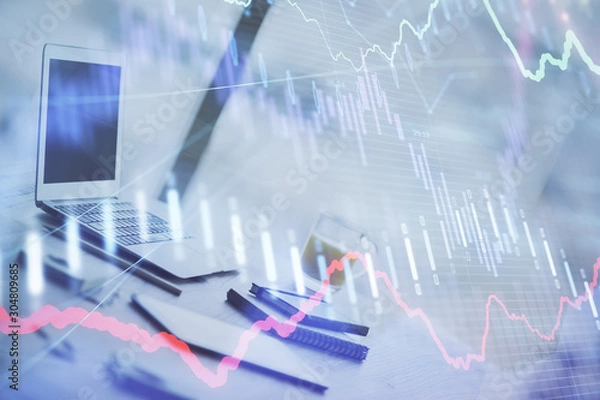 Obraz Forex graph hologram on table with computer background. Multi exposure. Concept of financial markets.