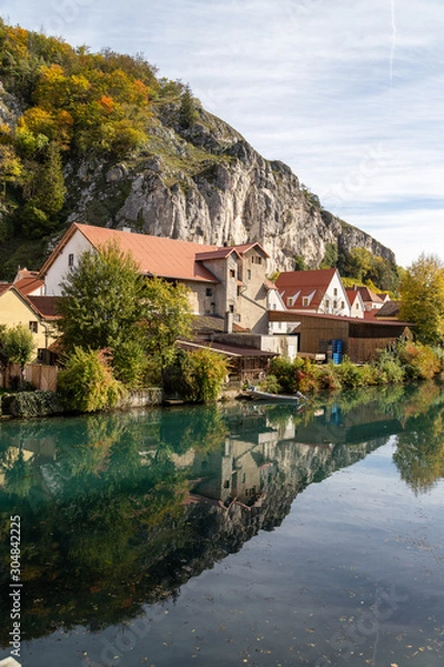 Obraz Idyllic view at the village Markt Essing in Bavaria, Germany with the Altmuehl river and high rocks