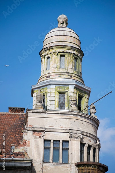 Fototapeta an ornate tower on the old building