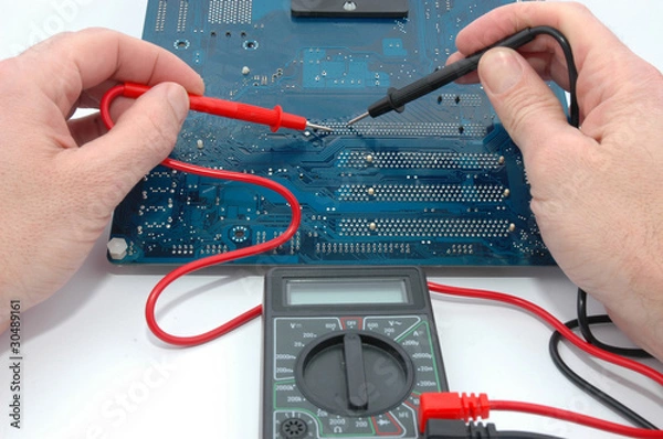 Obraz Repairing computer circuit board