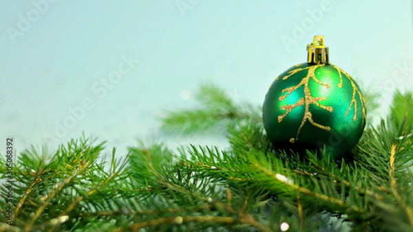 Obraz  Christmas ball on christmas tree isolated on blue