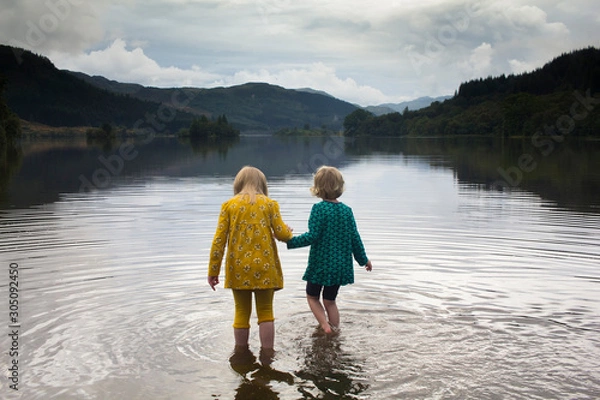 Obraz Two small children playing in a Scottish loch