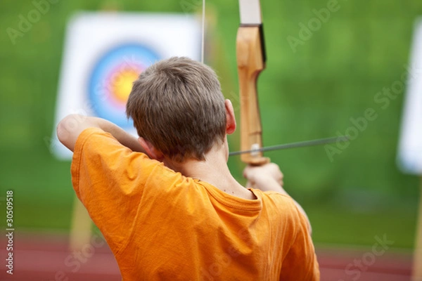 Obraz Kind beim Bogenschießen