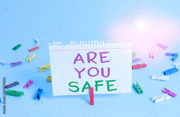 Fototapeta Word writing text Are You Safe. Business photo showcasing Free from danger Not anticipating any Harm Hurt physically Colored clothespin rectangle square shaped paper light blue background