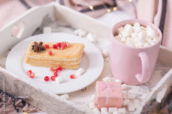 Fototapeta New Year and Christmas holiday mood concept. Cocoa mug with marshmellow and desster on the tray in Frech style