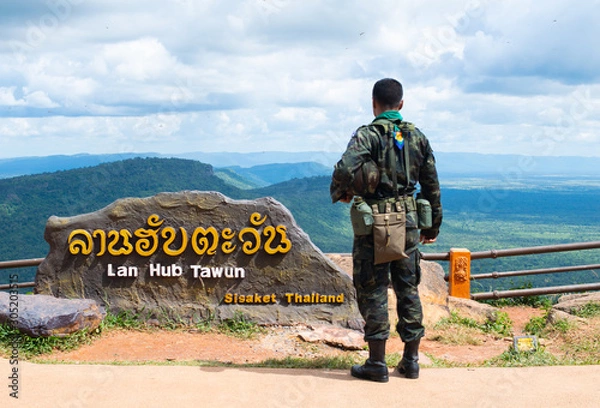 Fototapeta back view thai soldier on Mountain view in sisaket ( Pha Mo E Dang ),Thailand 2019