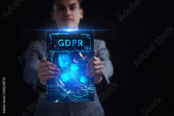 Fototapeta Business, Technology, Internet and network concept. Young businessman working on a virtual screen of the future and sees the inscription: GDPR