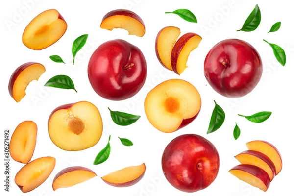 Obraz fresh red plum and half with leaves isolated on white background. Top view. Flat lay