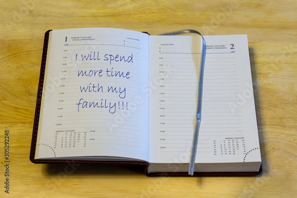 Fototapeta The diary is on the table. The diary is open on the first of January page. On the page it is written: "I will spend more time with my family!!!".