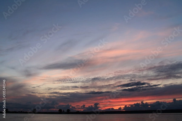 Fototapeta sunset over the river