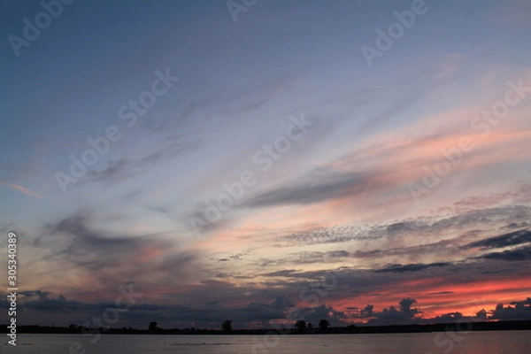 Fototapeta sunset over the river