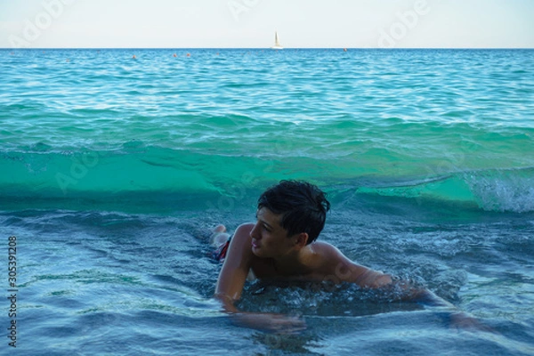 Obraz Boy enjoying the waves  at the beach