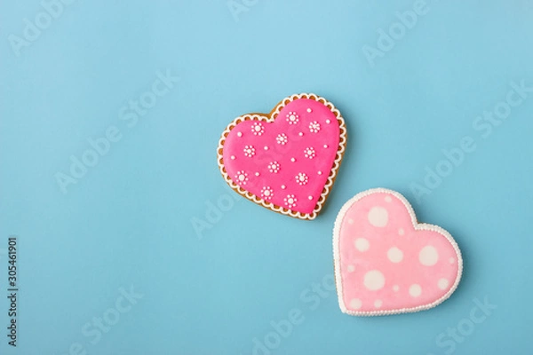Fototapeta Pink cookie heart shaped with different patterns, blue background