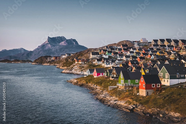 Fototapeta Nuuk capital of Greenland with Beautiful small colorful houses in myggedalen during Sunset Sunrise Midnight Sun. Sermitsiaq Mountain in Background. Blue and pink Sky.
