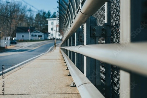 Fototapeta Sidewalk On A Bridge With Fence