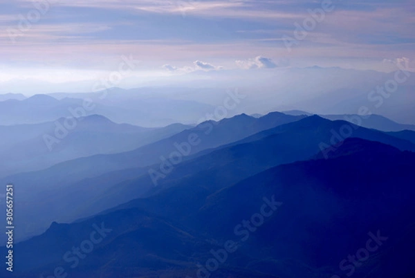 Fototapeta Flight above the Pyrénées with dramatic sunset, light and colors, France