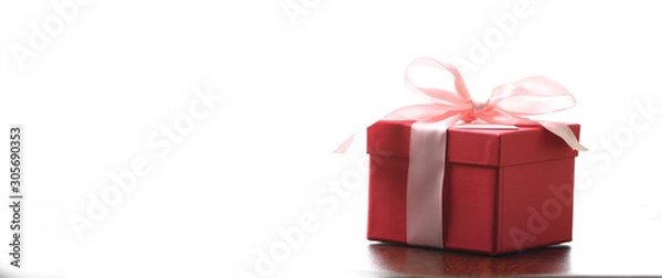 Fototapeta red christmas present with  bow and copy space